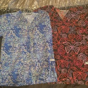 Two pairs of scrub tops
